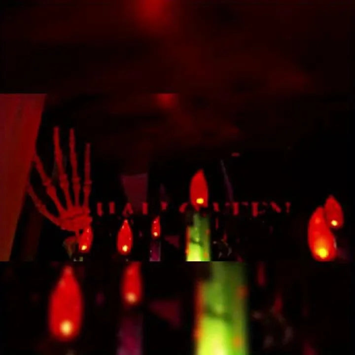 Skeleton Hands Hold Lighted Candle Stakes