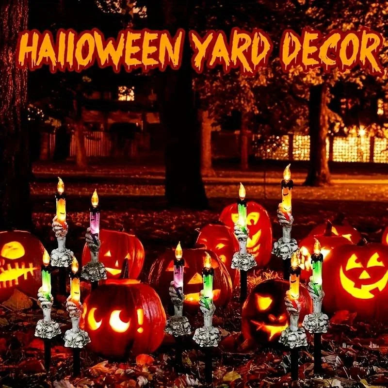 Skeleton Hands Hold Lighted Candle Stakes