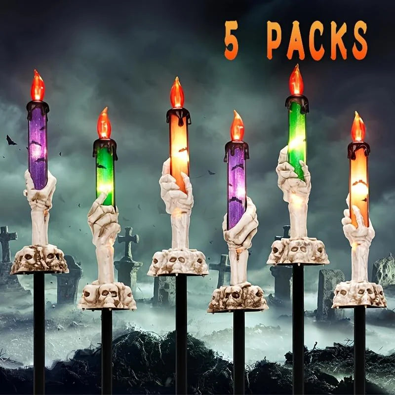 Skeleton Hands Hold Lighted Candle Stakes